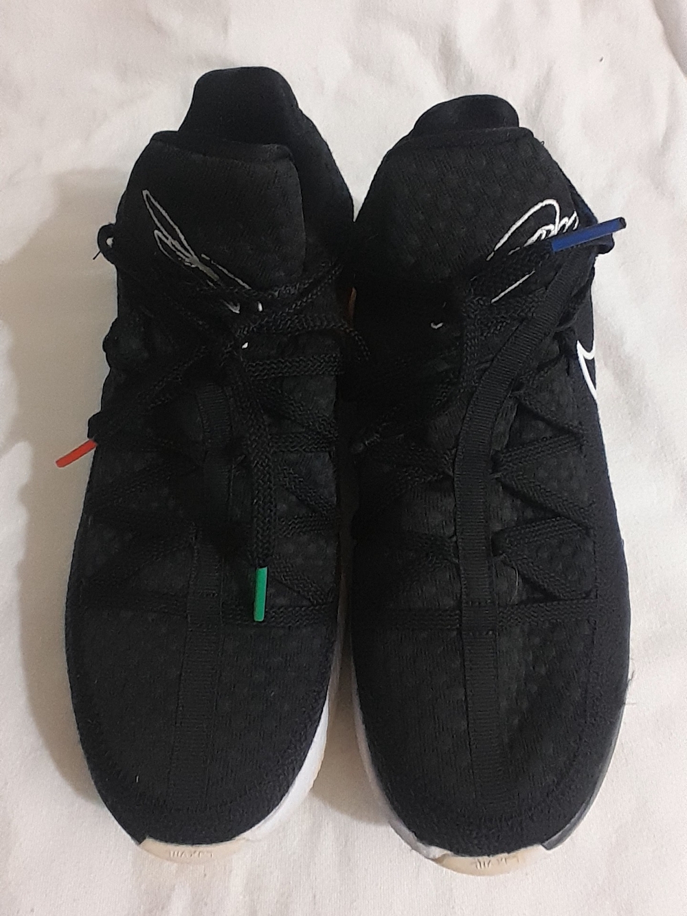 Nike Black Sneakers with Subtle Red, Green, and Blue Accents